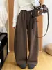 Novos calças pantalona de cintura alta, com caimento fluido, em mistura de lã para mulheres, apresentando um corte solto, emagrecedor e relaxado, com tornozelo afunilado e design estilo balão, perfeitas para outono e inverno