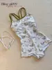 Traje de baño de una pieza floral con brillos al por mayor para mujer, estilo espalda cruzada, traje de baño conservador deportivo profesional para piscinas, modelo estudiantil