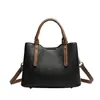 Bolsas de mano al por mayor transfronterizas, nuevos bolsos de hombro simples en bloques de color, bolsos versátiles y de moda para el uso diario, bolsas personalizadas