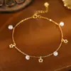 Bajo el árbol de banyan Plata de ley S925 verano nuevo estilo de hada flor pequeña tobillera para mujer alta gama exquisito circón borla cadena para el pie tobillera