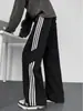 Pantalones de estilo americano con patrón de escamas de dragón en bloques de color para hombre, pantalones deportivos casuales de pierna recta para otoño, pantalones holgados de pierna ancha, modernos y elegantes