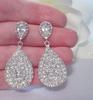 Pendientes nuevos de Cao Shi con forma de pera, temperamento, gotas de agua largas, pendientes de diamantes de imitación, pendientes transfronterizos europeos y americanos para mujer, joyería al por mayor