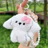 Lindo peluche con moño, llavero de cachorro, abalorios de perlas de alta gama, colgante de charm girly estilo Ins