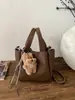 Bolso Cubo de Mano de Moda para Mujer Otoño e Invierno 2025 Nuevo Bolso de Hombro Sencillo Estilo Coreano Nicho de Gama Alta Casual Bolso para Mujer