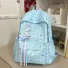 Mochila de bolinhas de alta qualidade para meninas, adequada para alunas do ensino fundamental II, com laço, grande capacidade e um design moderno e minimalista para uso escolar.