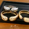Pulsera redonda abierta de estilo europeo y americano transfronterizo cepillada, con un diseño exagerado y único, una pieza de joyería moderna y a la moda para mujer
