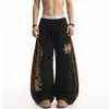 Pantalones de chándal casuales holgados de pierna ancha con estampado de leopardo, estampado de letras y rayas, estilo callejero americano de primavera y otoño, subcultura, para hombre
