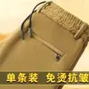 Atacado transfronteiriço de calças casuais de veludo cotelê outono e inverno, novos estilos para homens, corte solto, tamanhos grandes, calças de trabalho de corte reto para homens jovens e de meia-idade
