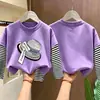 Camiseta de manga larga a rayas de algodón puro para niñas, colección primavera/otoño 2026, estilo nuevo, diseño de caricatura lindo, capa base versátil y a la moda