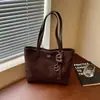 Bolsa de mano minimalista transfronteriza, nuevo estilo 2026, gran capacidad, bolso de hombro moderno, texturizado, casual y adecuado para el trabajo, se puede llevar debajo del brazo