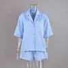 Pijama de estilo europeo y americano nuevo 2026, lujo ligero, satén, seda de hielo, color liso, manga corta, pantalones cortos, cómodo conjunto de dos piezas para ropa de casa de mujer