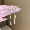 Brincos de agulha de prata banhados a ouro com franja de diamante, design personalizado de luxo leve, brincos de temperamento de nicho, brincos da moda para mulheres