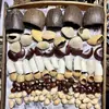 Cáscara de Fruta Natural Campana de Agua Pinza Pato Fruta Negra Tendón de Vid Huevo de Fénix Nuez Moscada Muñeca de Cáscara de Fruta Campana de Viento Rattle Hecho a Mano DIY