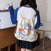 Pantalones Pequeños Frescos de Dibujos Animados con Cordón y Bolsillo con Solapa Fabricante al por Mayor Bolso de Lona Lindo para Mujer 2025 Nuevo Bolso de Lona para Estudiante