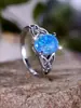 Deseo transfronterizo AliExpress moda viajero Palladium Blanco K forma de huevo borde de ópalo azul anillo cruzado suministro de fábrica al por mayor