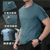 Camiseta Masculina de Manga Curta com Secagem Rápida e Absorção de Umidade, Respirável Tipo Algodão, Corte Solto para Corrida, Gola Redonda, Roupa de Trabalho com Bolsos Funcionais, Primavera/Verão 2026