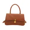 Bolsa de mão de luxo leve estilo coreano para atacado para mulheres, novo modelo de verão 2026, bolsa de ombro com fecho de cor sólida, bolsa transversal para o dia a dia