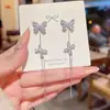Pendientes de borla de mariposa con zircón largo ultrabrillante de lujo ligero diseño de pendientes de nicho pendientes de temperamento de alta gama venta al por mayor