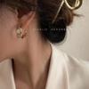 Pendientes retro clásicos de metal europeos y americanos para mujer, pendientes de estilo socialité con diseño de viento frío, joyería de oído de alta calidad al por mayor