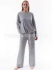 Traje casual de moda nuevo transfronterizo europeo y americano 2023 para mujer, color liso, alta elasticidad, moldeador corporal, manga corta, pantalones de pierna ancha, conjunto de dos piezas
