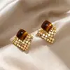 Brincos Olho de Tigre Estilo Melanoid Retro Senso de Design de Nicho Brincos Versáteis Luxo Leve Moda de Alta Qualidade Brincos de Tarraxa para Mulheres