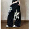 Pantalones de chándal anchos estampados con bloques de color estilo callejero americano para mujer, corte holgado, adelgazantes, versátiles, cintura elástica, pantalones casuales de pierna recta, modernos