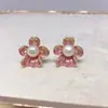 Pendientes de botón de flor de perla con aguja de plata S925 para mujer, pendientes de estilo francés de alta gama, nuevo estilo popular 2026, joyería para orejas de temperamento versátil