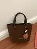 Bolso tipo cubo de estilo retro para mujer, nueva colección otoño 2026, bolso de hombro simple y casual con diseño coreano
