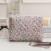 Suministro transfronterizo gran capacidad estilo coreano bolsa de cosméticos portátil bolsa de mamá bolsa de almacenamiento floral bolsa de pañales acolchada bolsa para labiales