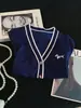Cardigan Curto Branco de Tricô da Moda Feminino para o Verão de 2026 com Bordado de Cachorro e Padrão Perfurado