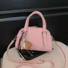 Bolsa de almohada de bolos de diseñador rosa de nicho para mujer, nuevo modelo 2026, bolso cruzado de alta gama de nicho de lujo ligero