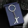 Chaveiro de Metal Criativo com Diamante 26 Letras Pingente de Bolsa Colar Simples com Pingente de Letra Acessórios DIY Atacado