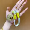 Regalos del Festival del Medio Otoño para Clientes: Pasteles de Luna, Bolsas de la Suerte, Dijes Dorados para Teléfono, Llaveros, Cadenas para Teléfono, Dijes para Bolsos
