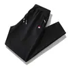 Pantalones deportivos de otoño para hombre, pantalones casuales, transpirables, para correr, de punto, con bolsillo y cremallera