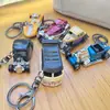 Llavero creativo de mini coche deportivo de fricción, coche de aleación con puertas que se abren, accesorio para mochila infantil, regalo de coche
