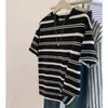 Camiseta Redonda de Manga Corta con Rayas Blancas y Negras Europeas para Mujer Primavera y Verano 2025 Nuevo Top Holgado Americano de Media Manga en el Hombro Derecho
