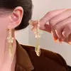 Aretes Colgantes Largos con Borla de Flor Pequeña de Piedra Ojo de Gato para Mujer Diseño con Sentido Popular en Internet Aretes Versátiles Nuevos Aretes de Moda