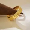 Anillos de Trébol de Cuatro Hojas Chapados en Oro de Alta Gama de Nicho de Moda Anillos de Pareja Anillo Cerrado de Calidoscopio de la Suerte de Imitación de Oro