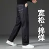 Jeans azules de otoño Xintang para hombre, estilo recto holgado, nueva colección 2026, pantalones casuales elásticos para primavera y otoño