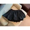 Saia Curta Meia-Calça Xadrez Florido de Verão Feminina Petite Moda Casual Cintura Alta Evasê Menina Quente Antiexposição Fofa