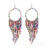 Pendientes de borlas con cuentas de arroz largas estilo étnico bohemio retro, joyería popular europea y americana, suministro transfronterizo para mujer
