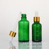 Botella de vidrio verde con gotero oscuro de 5 a 100 ml con escala, venta al por mayor, para aceites esenciales, esencias líquidas, cosméticos, subembotellada.