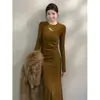 Vestido de punto de manga larga hueco de color liso para otoño e invierno, de estilo francés sofisticado, corte ajustado y silueta que se adapta al cuerpo, para mujer.