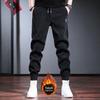 Calças de veludo cotelê de outono e inverno transfronteiriças Calças masculinas forradas de lã Calças casuais masculinas pretas Calças largas e cônicas da moda plus size
