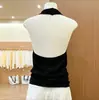 Chaleco tejido negro estilo coreano con cuello halter y espalda descubierta para mujer, nuevo top sin mangas chic de verano 2026, color liso, efecto adelgazante