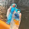 Llavero creativo de concha pequeña con aceite, lindo colgante pequeño de arena movediza líquida, accesorios para bolso, pequeño colgante de regalo, venta al por mayor