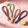 Correas de muñeca tejidas a mano de colores para teléfono de comercio exterior, disponibles en varios colores, llaveros, colgantes para bolsos y botellas de agua, venta al por mayor desde el fabricante