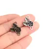 Yiwu Venta al por mayor de productos pequeños Colgantes de flor de rosa estilo antiguo europeo y americano Accesorios de joyería Huangdan 100 Piezas/Paquete