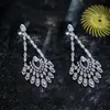 Pendientes de botón con colgante de gota de agua hueca de circón de aguja plateada, pendientes de lujo ligero de alta gama, temperamento, exquisitos, versátiles, nicho para mujer