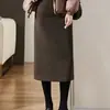 Otoño e invierno Nueva falda negra de cintura alta con abertura Falda de lana línea A falda simple para mujer para ir al trabajo